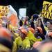 Michigan fans cheer and hold signs during a live broadcast of ESPN Game Day at Ingalls Mall on Saturday morning. Melanie Maxwell I AnnArbor.com